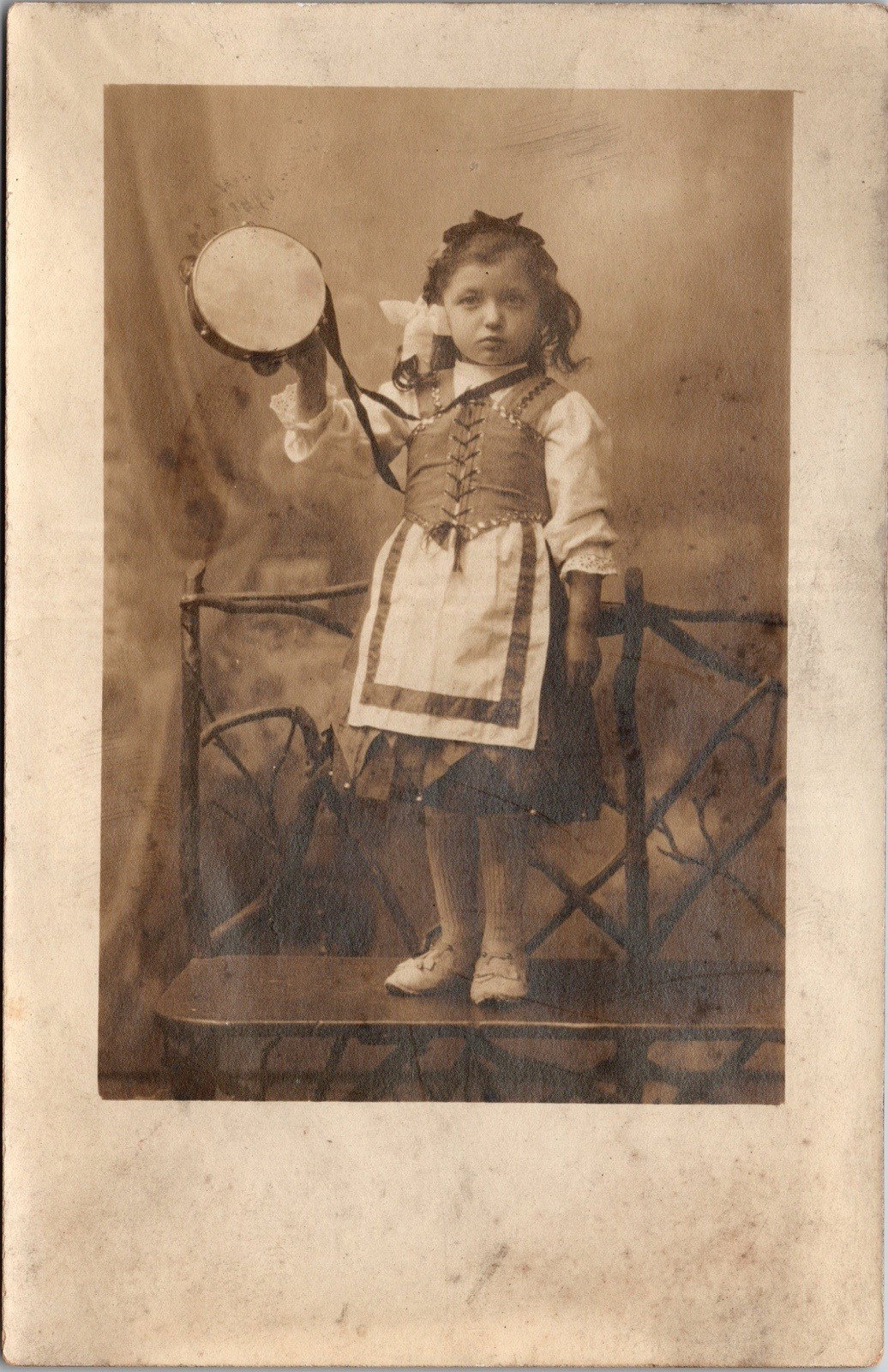 Postcard Real Photo RPPC Young Girl Valentina Standing on Bench with Tambourine Postcard Real Photo RPPC Young Girl Valentina Standing on Bench with Tambourine