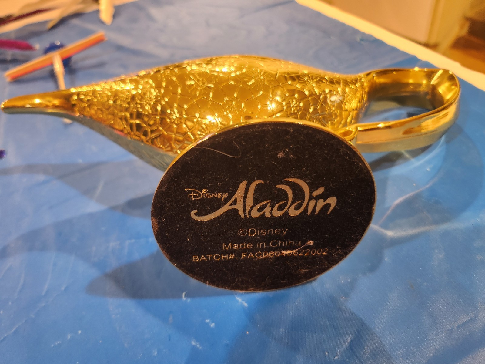 This gold-plated replica of the Cave of Wonders magic lamp from Disney's Aladdin This gold-plated replica of the Cave of Wonders magic lamp from Disney's Aladdin