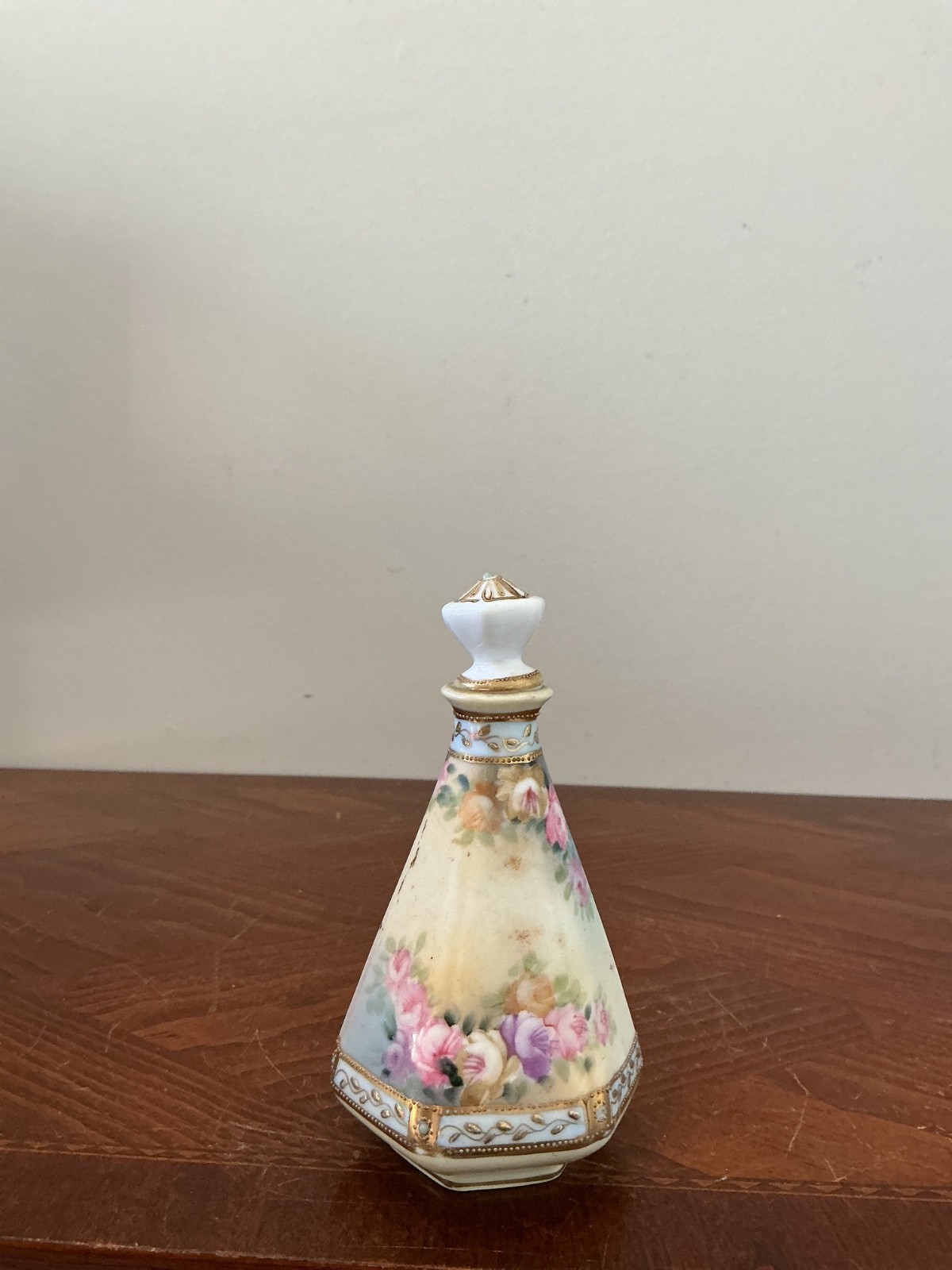 Nippon antique faceted porcelain perfume or scent bottle featuring hand-painted 