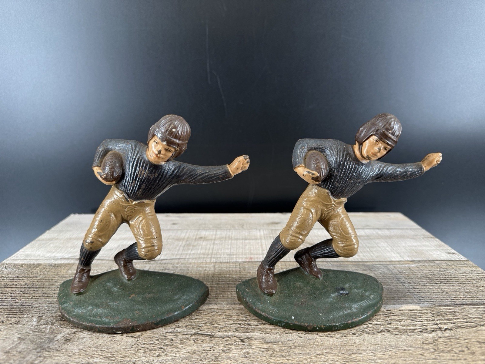 antique Hubley cast iron football player bookends from the 1920s. antique Hubley cast iron football player bookends from the 1920s.