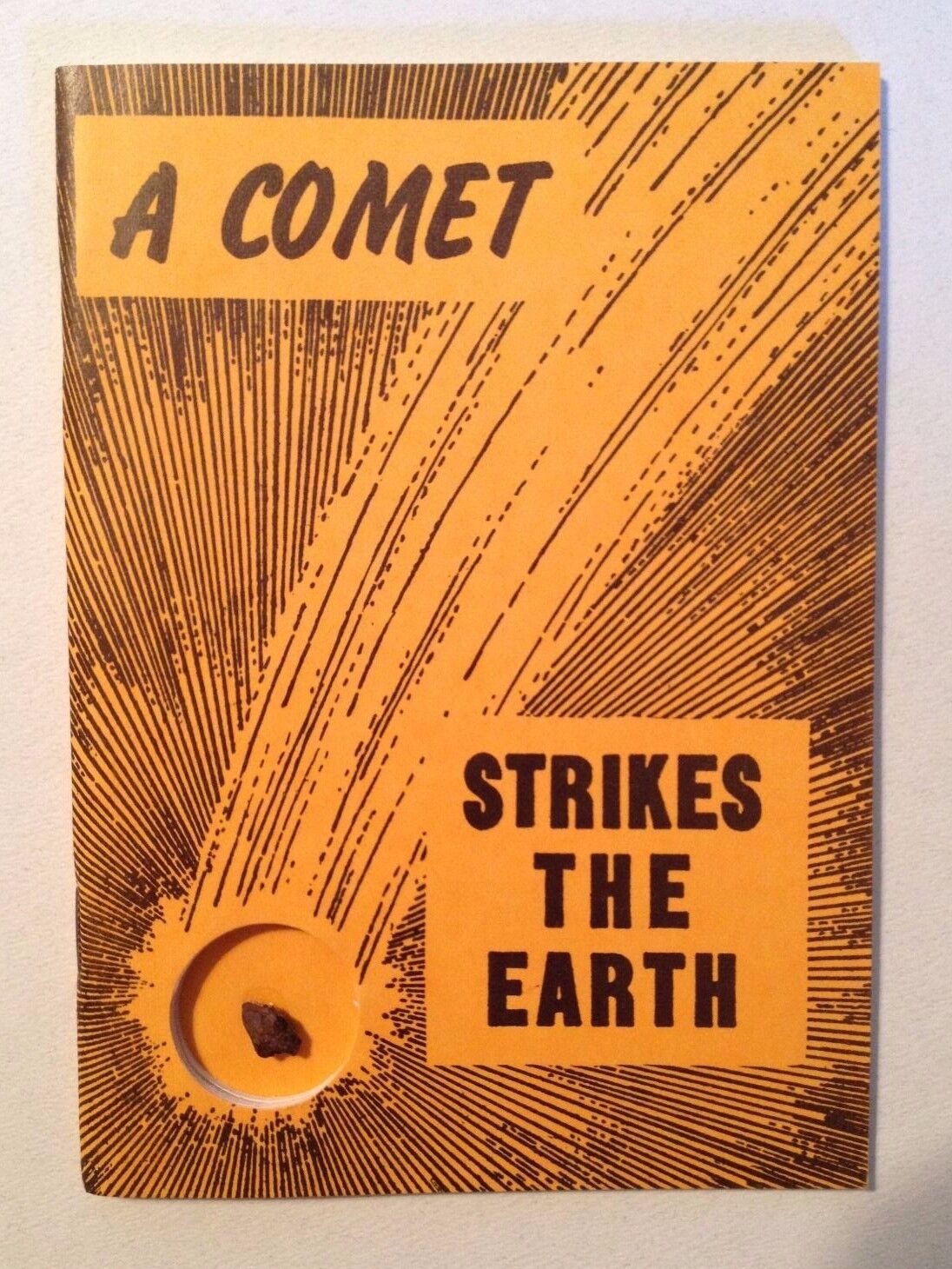 A Comet Strikes the Earth by Nininger (1969 reprint), with meteorite specimen