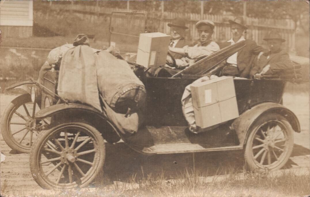 1918 RPPC - DELIVERING MAIL IN FORD MODEL T AUTOMOBILE - old real photo postcard