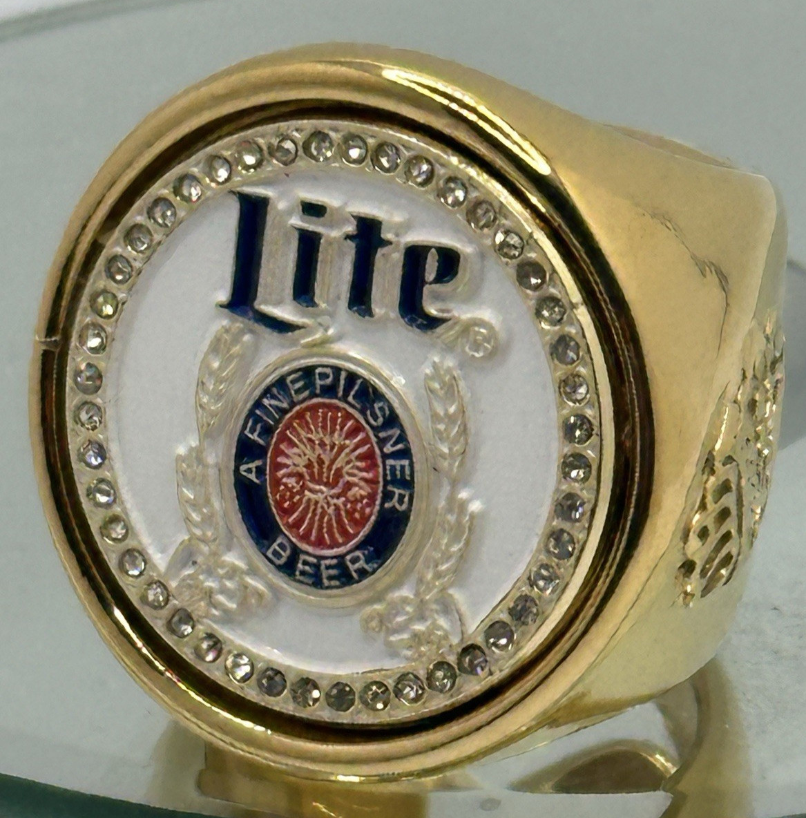 The Miller Lite deCAPitator Ring Bottle Cap & Can Tab Opener The Miller Lite deCAPitator Ring Bottle Cap & Can Tab Opener