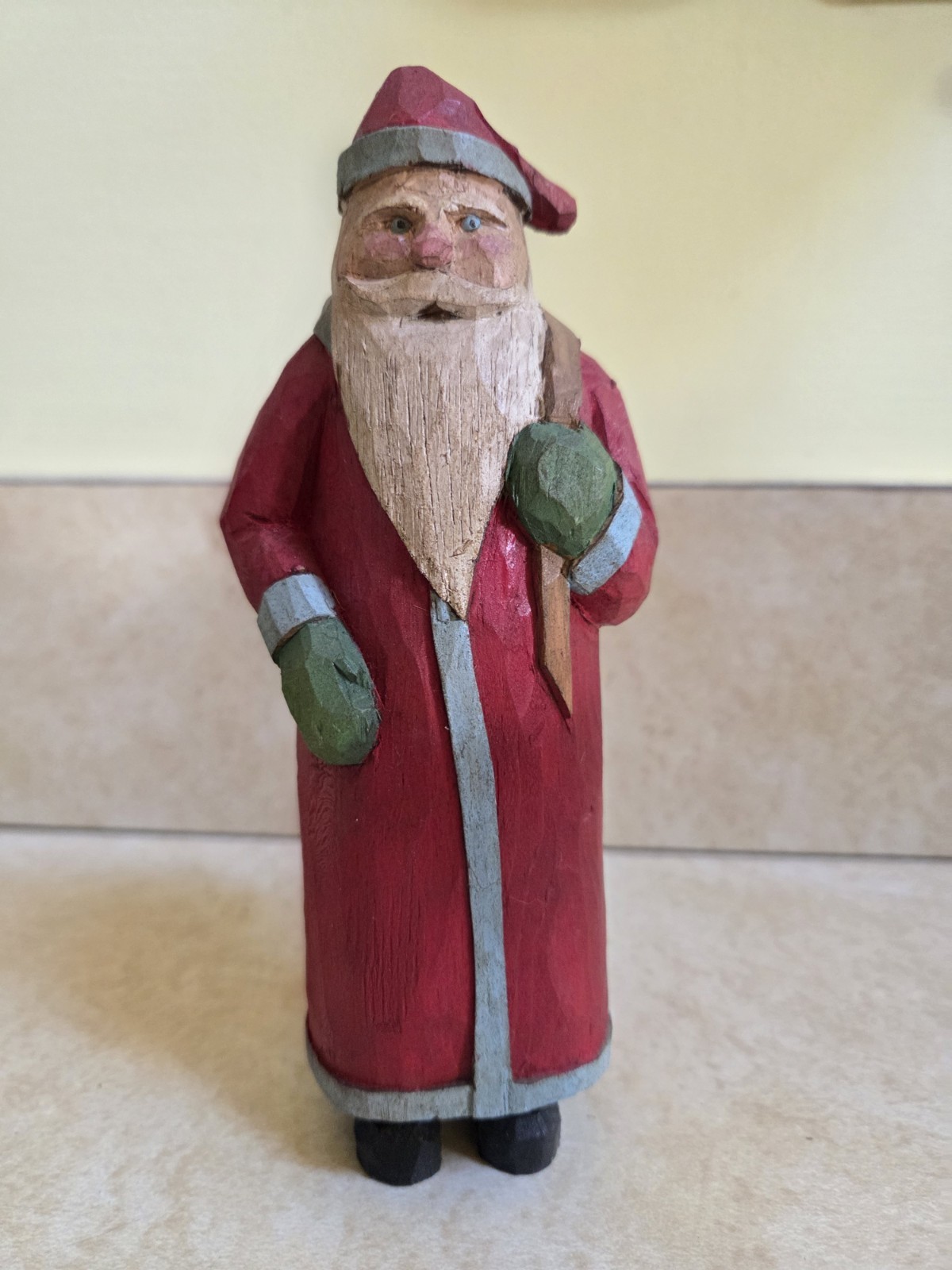 Vintage hand carved wooden old world santa with toy sack figurine