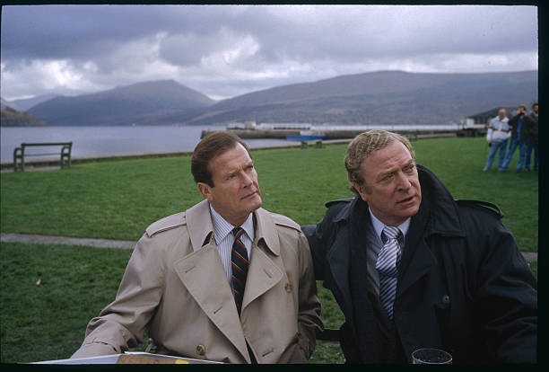 British actors Roger Moore and Michael Caine brave typically gray - Old Photo British actors Roger Moore and Michael Caine brave typically gray - Old Photo
