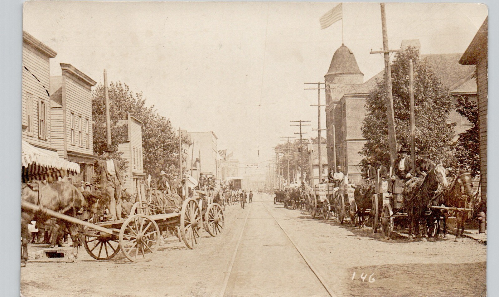 DOWNTOWN STREET SCENE waupun wi c1910 postcard wisconsin real photo rppc wagon