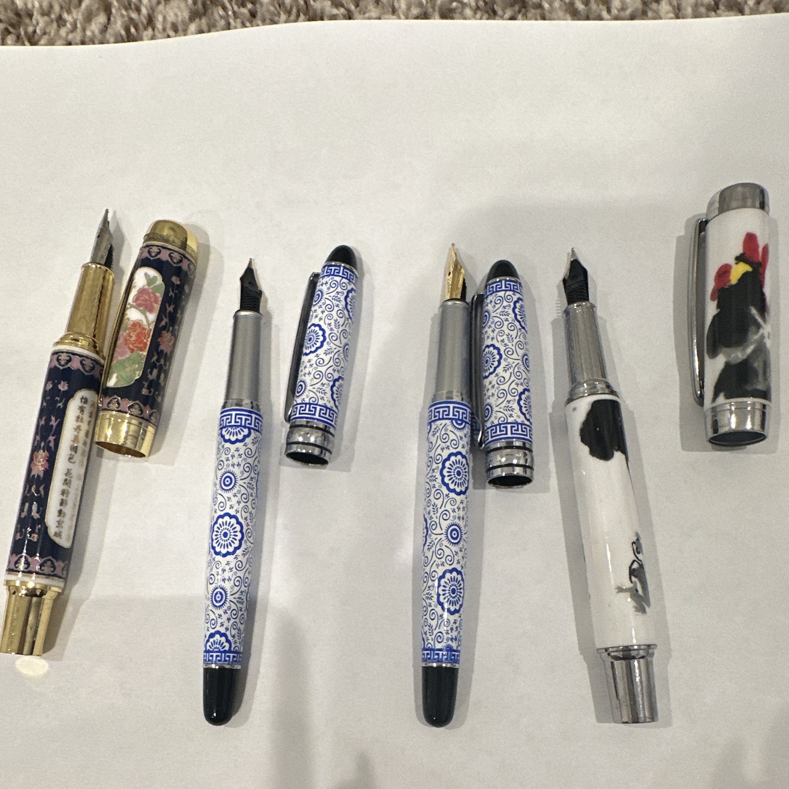 Lot of 4 Metal Fountain Pens Gold & Chrome Trim Blue/White, Floral, Rooster Lot of 4 Metal Fountain Pens Gold & Chrome Trim Blue/White, Floral, Rooster