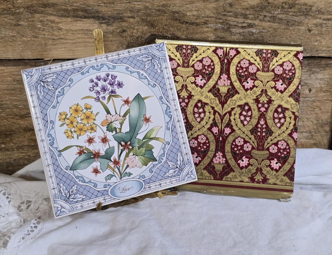 NIB 51983 Avon Floral Expressions Collector Tile - Love Hangs Trivet 6” X 6” NIB 51983 Avon Floral Expressions Collector Tile - Love Hangs Trivet 6” X 6”