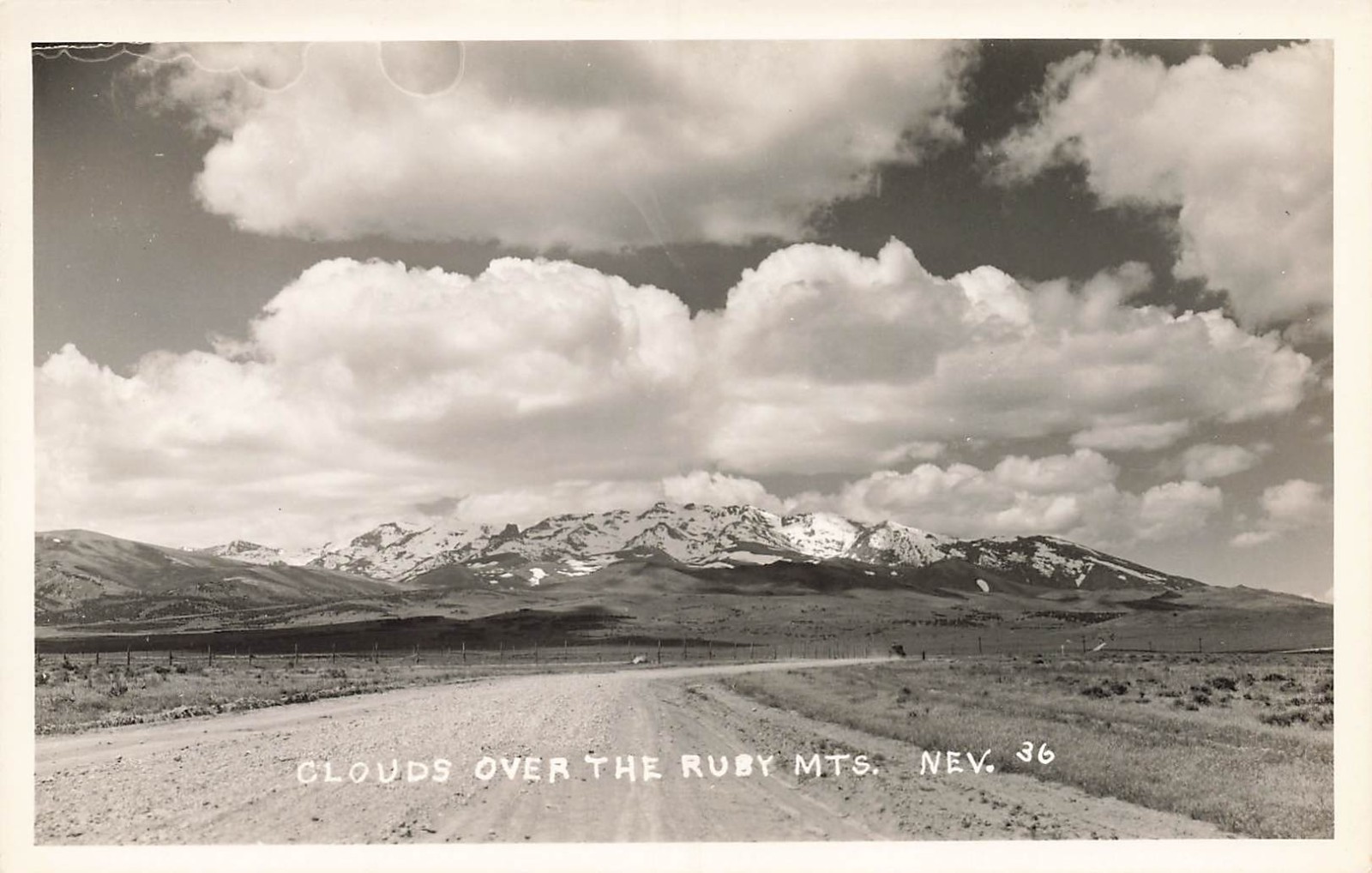 LP14  Elko County Nevada Clouds over  Ruby Mountains  RPPC Postcard