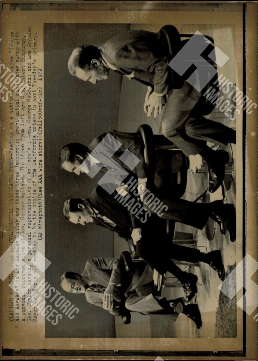 1972 Three men in suits are sitting in chairs 1972 Three men in suits are sitting in chairs