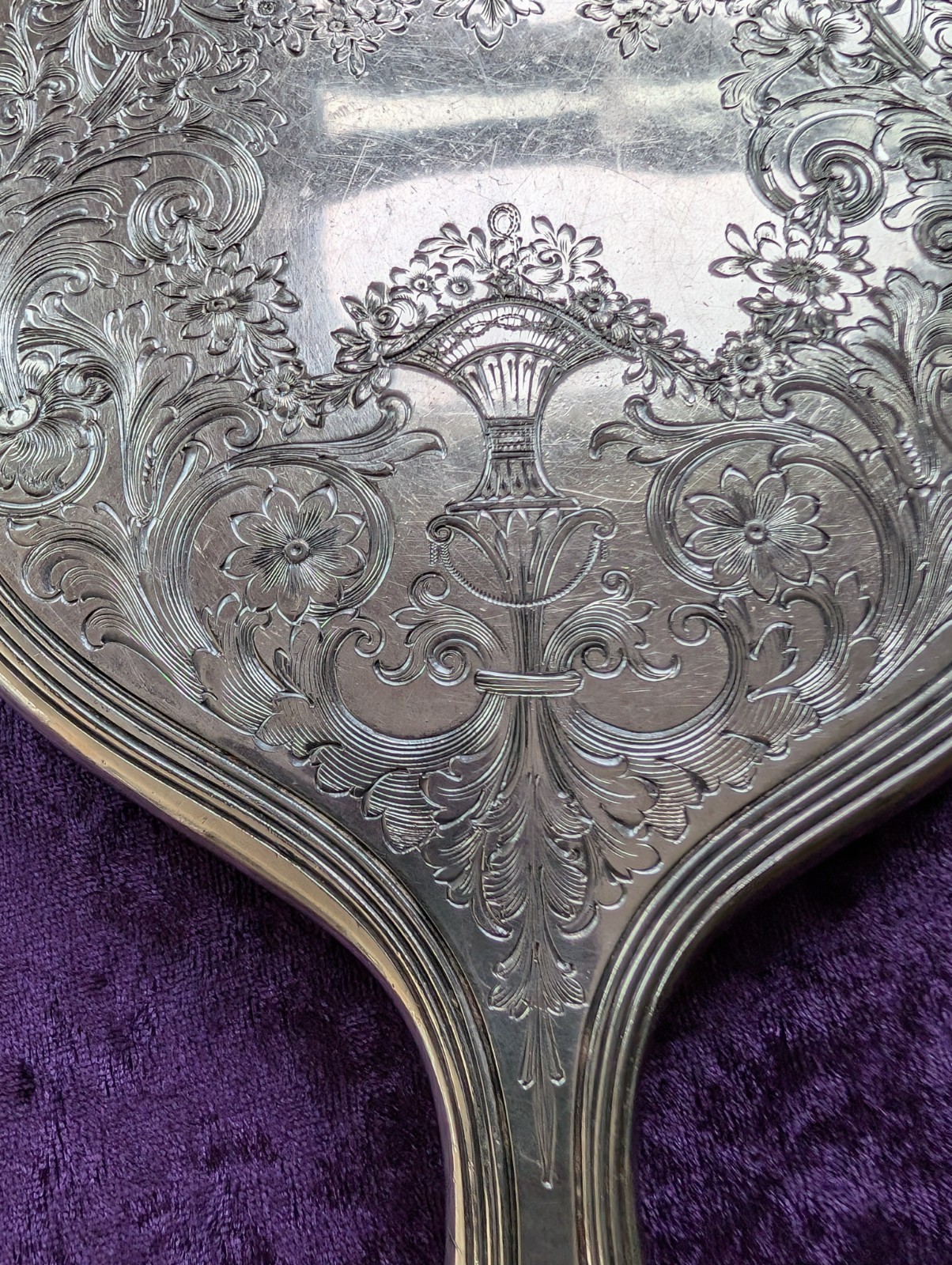 Vintage Silver Hand Mirror with Etched Flower Basket and Scrolls Design Vintage Silver Hand Mirror with Etched Flower Basket and Scrolls Design
