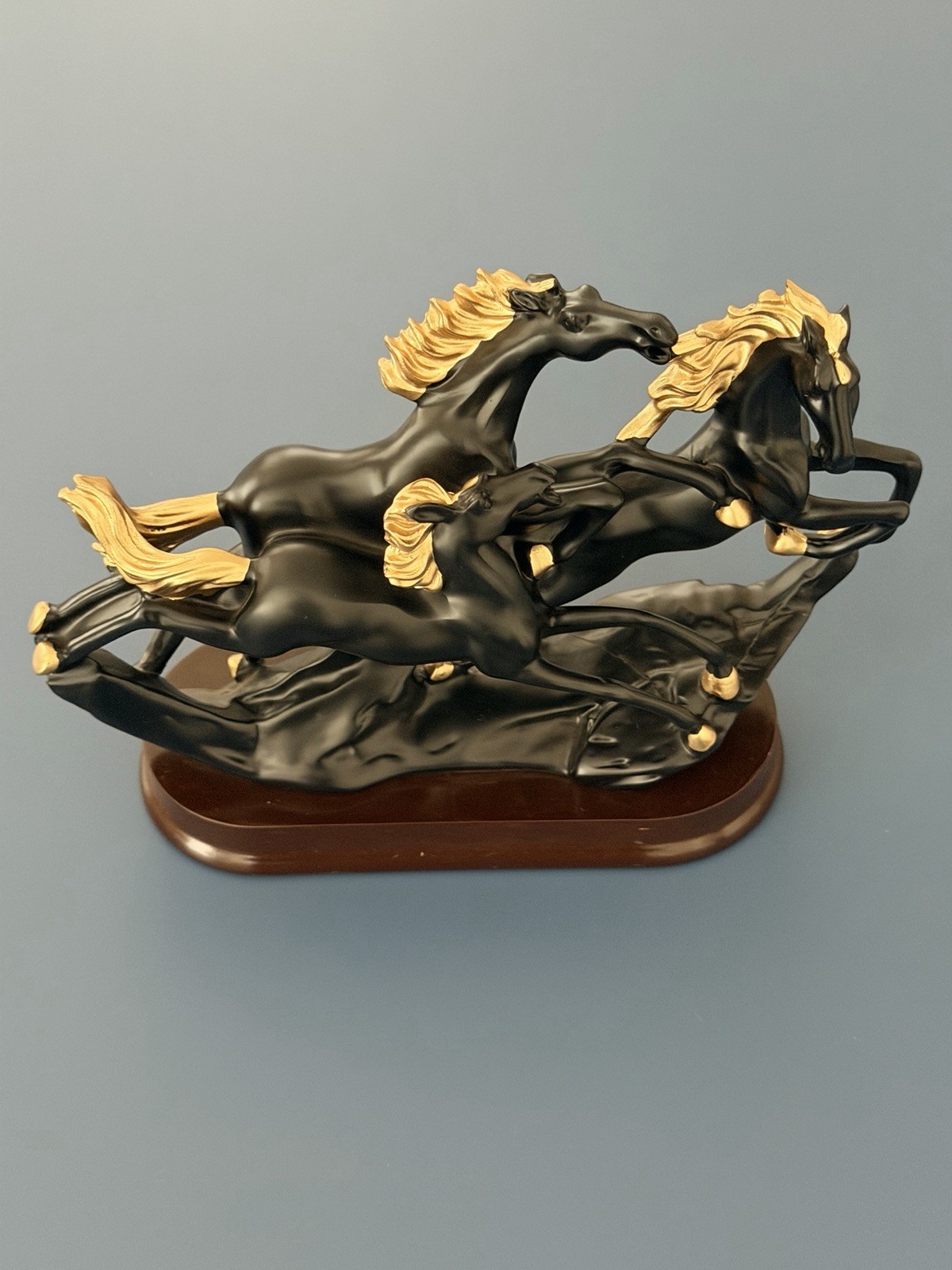 Elegant Black & Gold Running Horses Sculpture on Plastic Base