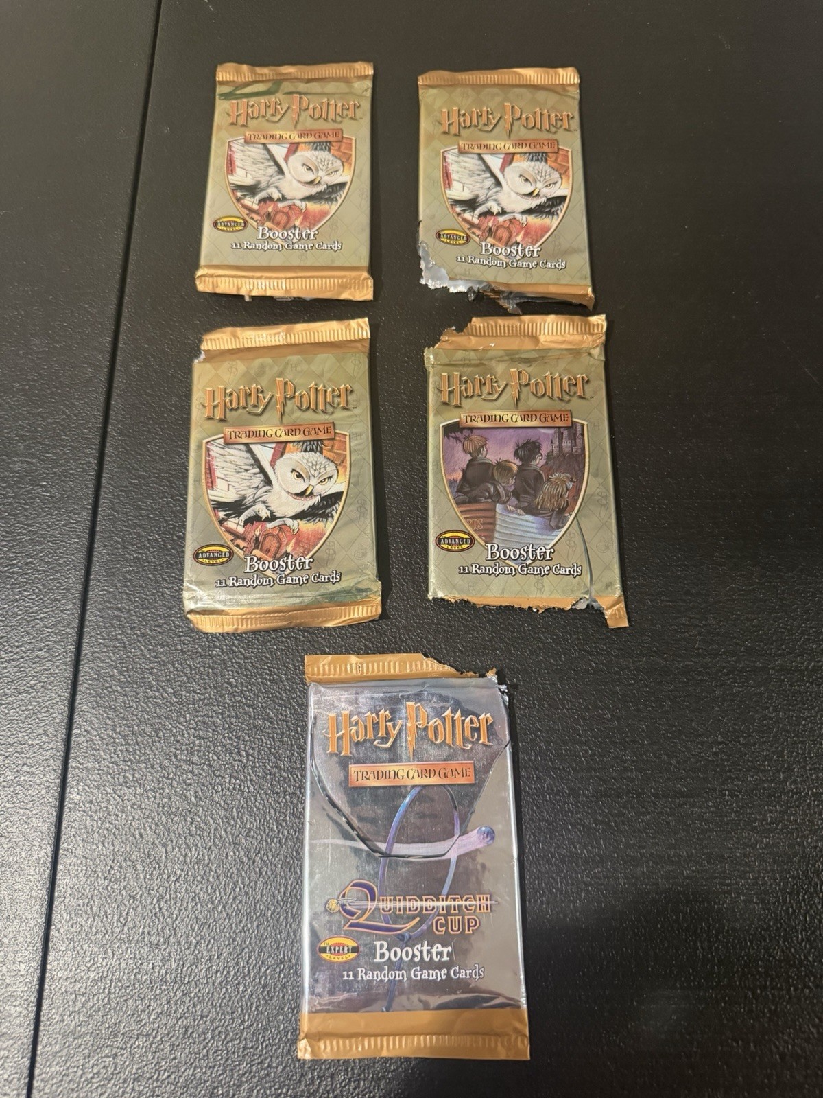 5X Vintage Empty Harry Potter WoTC Booster Packs (4 Base & 1 Quidditch Cup) 5X Vintage Empty Harry Potter WoTC Booster Packs (4 Base & 1 Quidditch Cup)