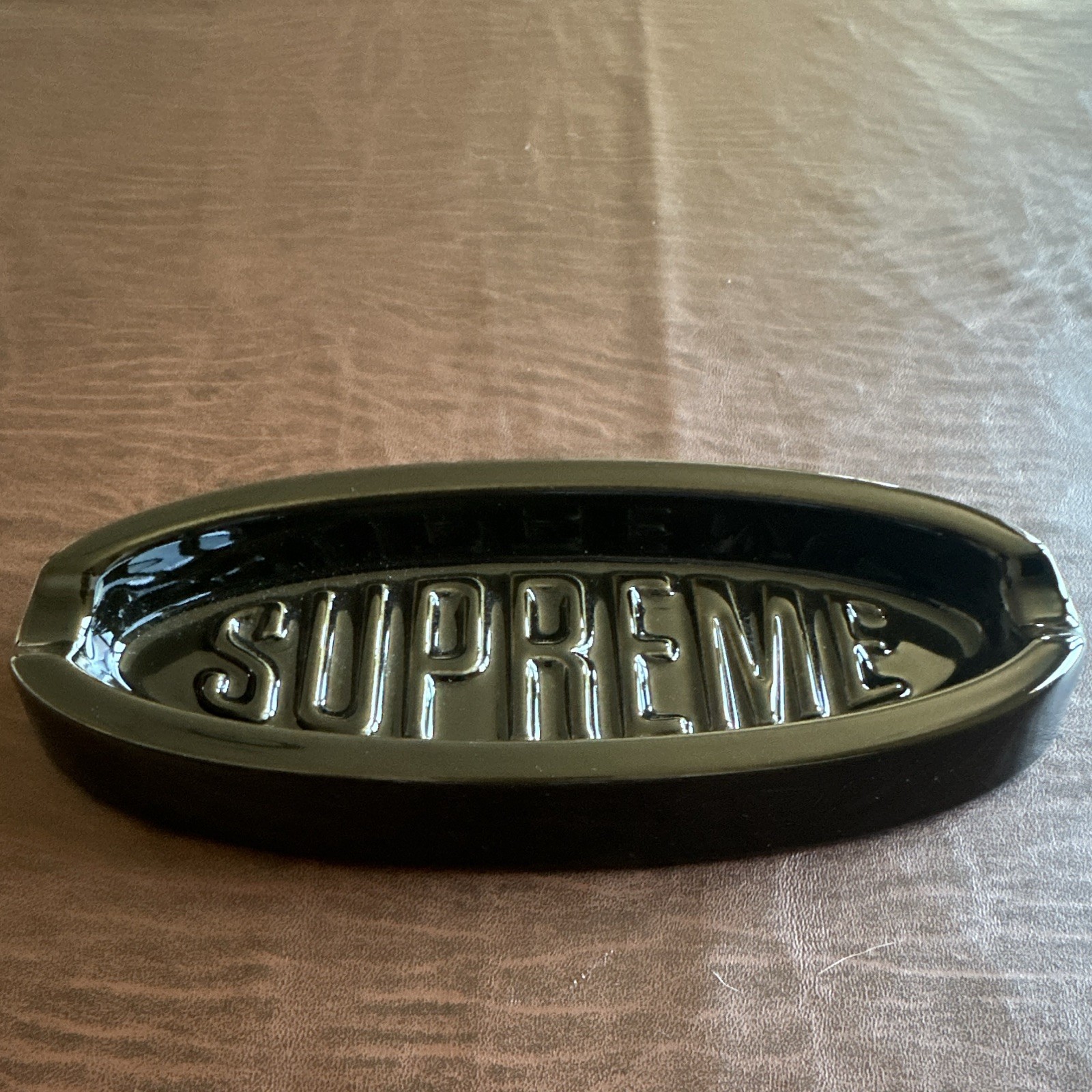 Supreme Mfg. Co. New York City Oval Black Ashtray/tray, Embossed “SUPREME” Supreme Mfg. Co. New York City Oval Black Ashtray/tray, Embossed “SUPREME”