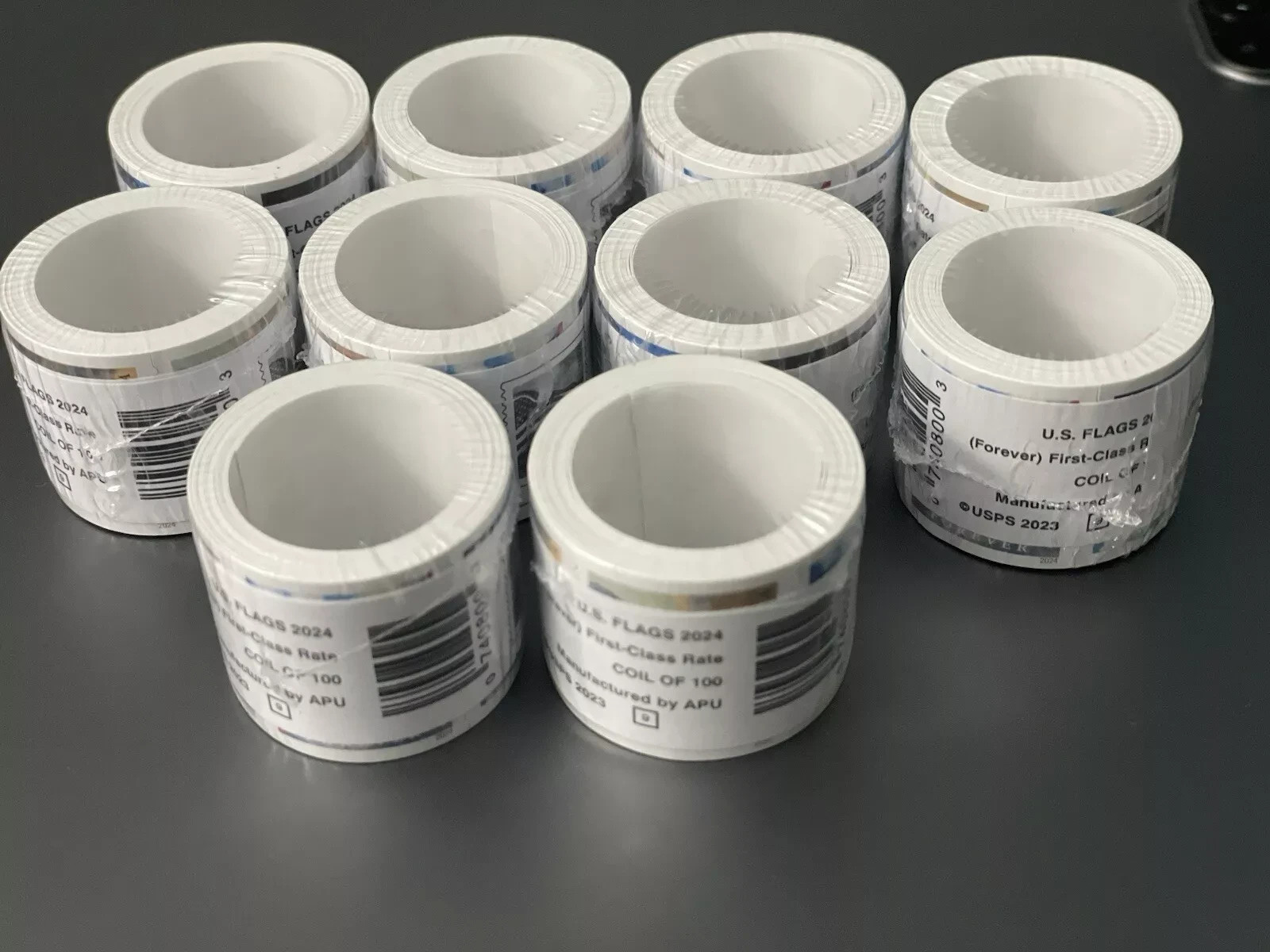 10 rolls of 100 USPS postage stamps, totaling 1000 pieces 10 rolls of 100 USPS postage stamps, totaling 1000 pieces