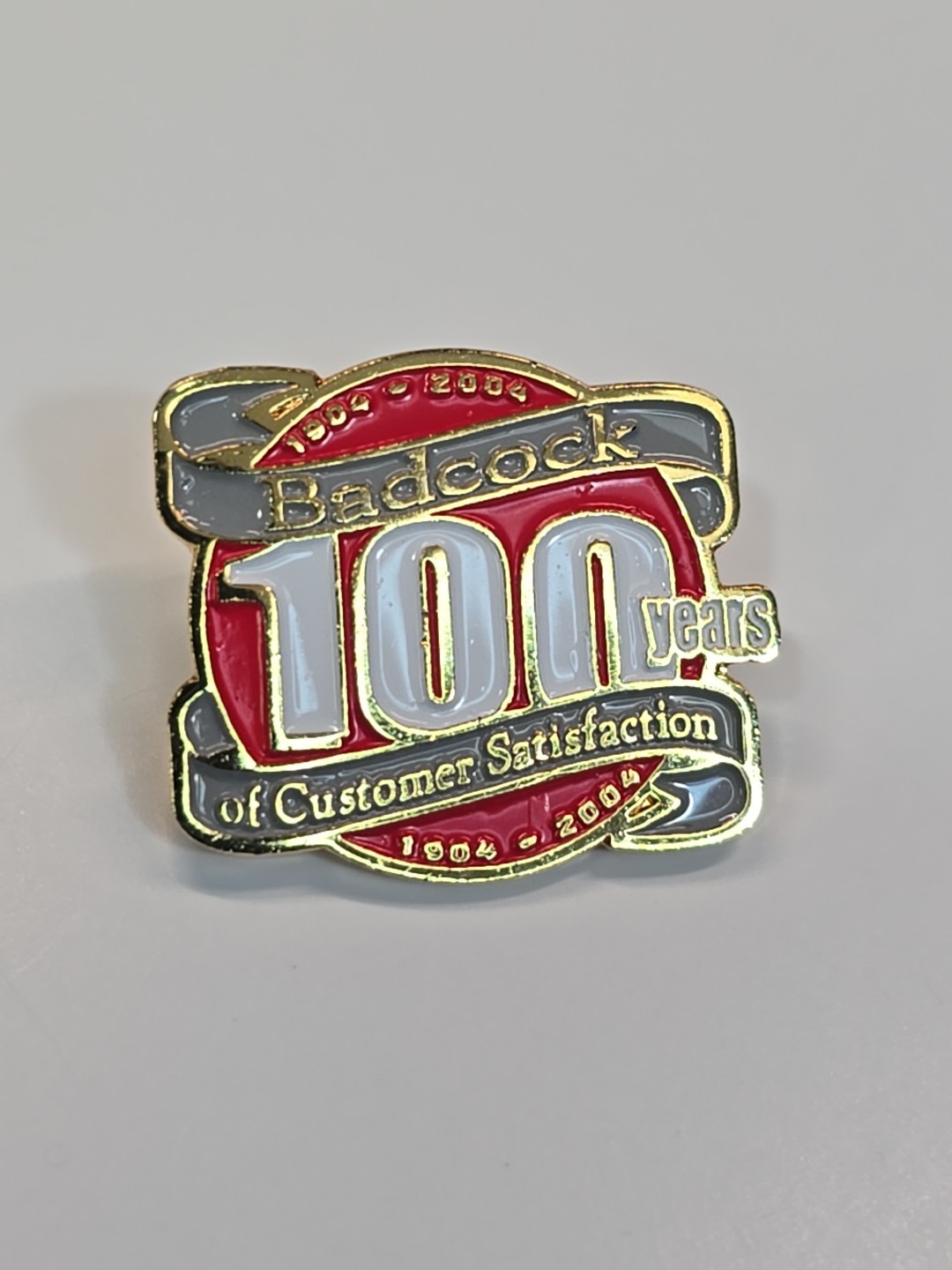 Badcock 100 Years of Customer Satisfaction Lapel Pin 1904-2004 Defunct 2024