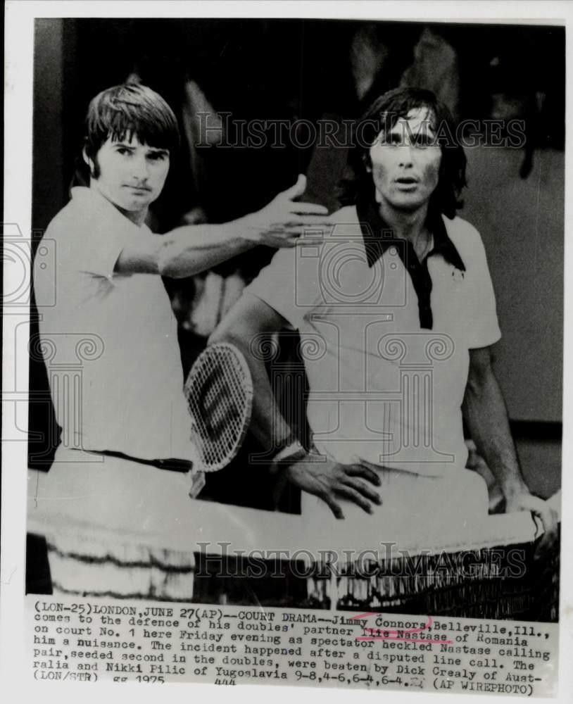 1975 Press Photo Jim Connors & Ilie Nastase during Doubles Tennis Match, London 1975 Press Photo Jim Connors & Ilie Nastase during Doubles Tennis Match, London