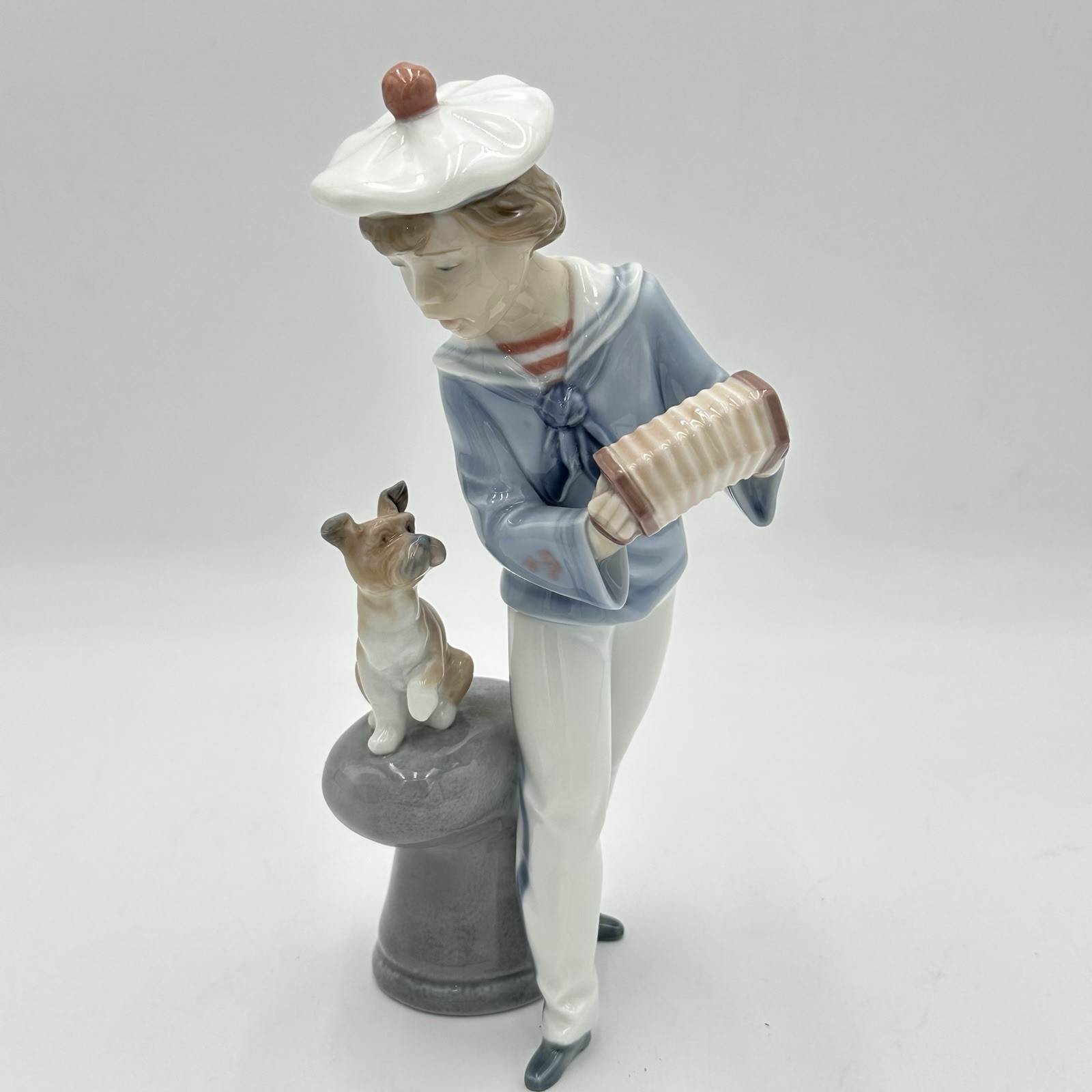 Lladro Seaside Serenade Boy Playing Accordion with Dog #6197 Figurine Lladro Seaside Serenade Boy Playing Accordion with Dog #6197 Figurine