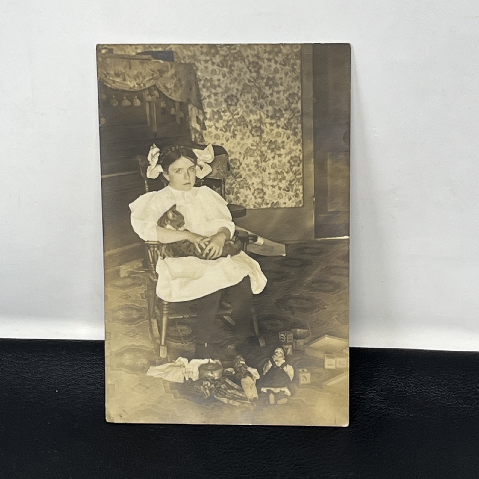 Vintage RPPC Young Girl Holding Cat in rocking chair toys dolls blocks Postcard Vintage RPPC Young Girl Holding Cat in rocking chair toys dolls blocks Postcard