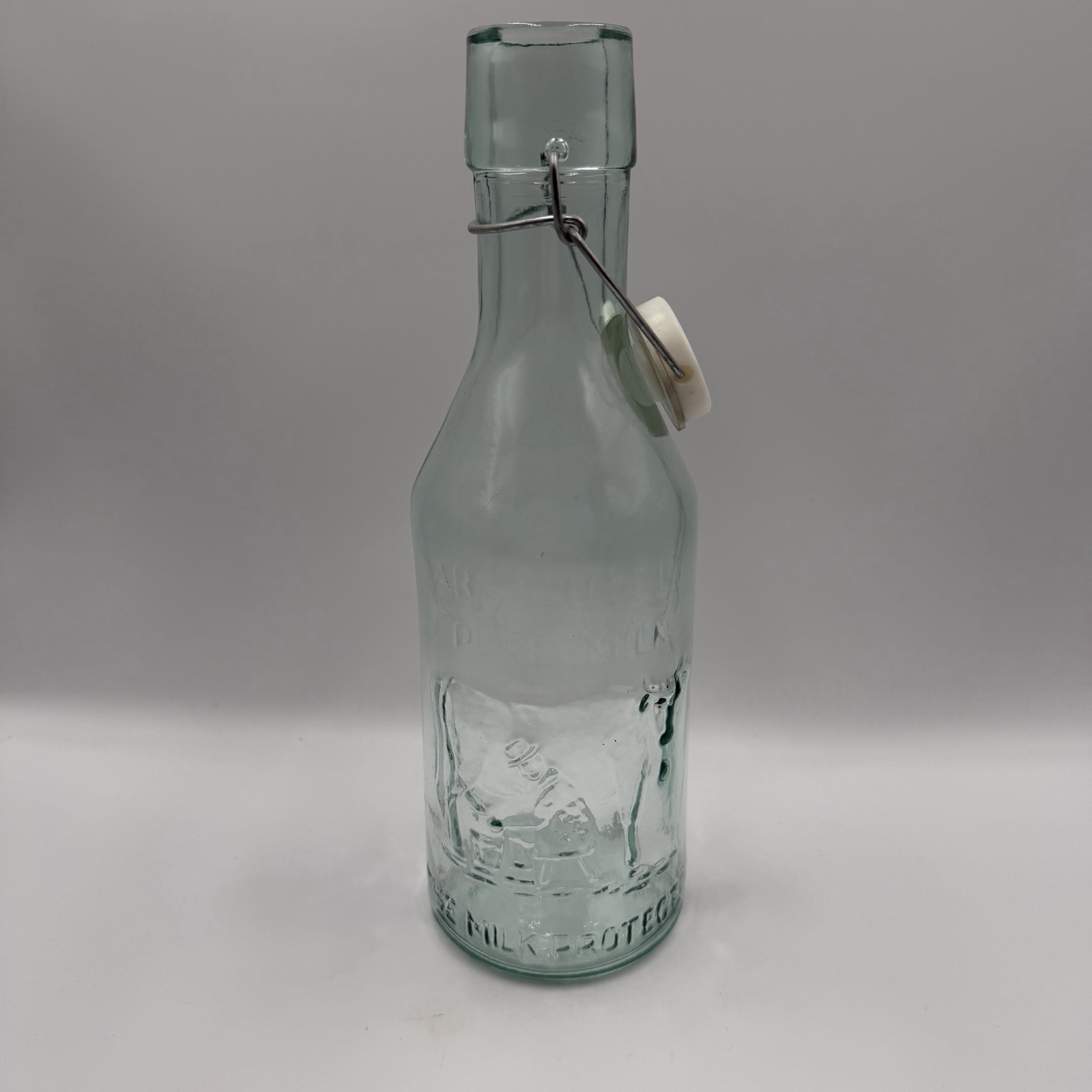 Vintage Absolutely Pure Milk Glass Bottle with Swing Top Vintage Absolutely Pure Milk Glass Bottle with Swing Top