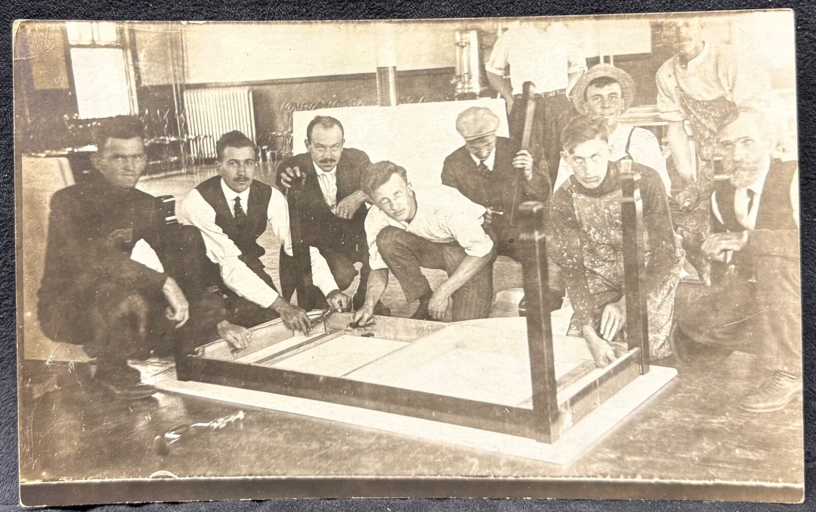 REAL PHOTO-BIG GROUP OF MEN PUT TABLE TOGETHER~FURNITURE FACTORY-RPPC POSTCARD