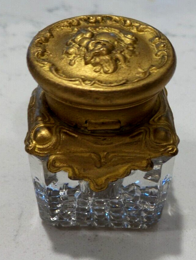 ANTIQUE SMALL ORMOLU AND GLASS HINGED INKWELL WITH CUPID ON TOP PAT. DEC/28/97 ANTIQUE SMALL ORMOLU AND GLASS HINGED INKWELL WITH CUPID ON TOP PAT. DEC/28/97