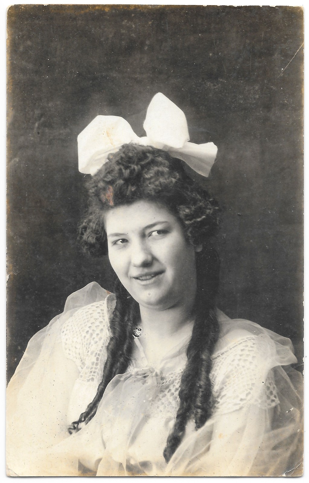 RPPC c1910s Studio Portrait Young Woman Big Bow Curls Real Photo Postcard RPPC c1910s Studio Portrait Young Woman Big Bow Curls Real Photo Postcard