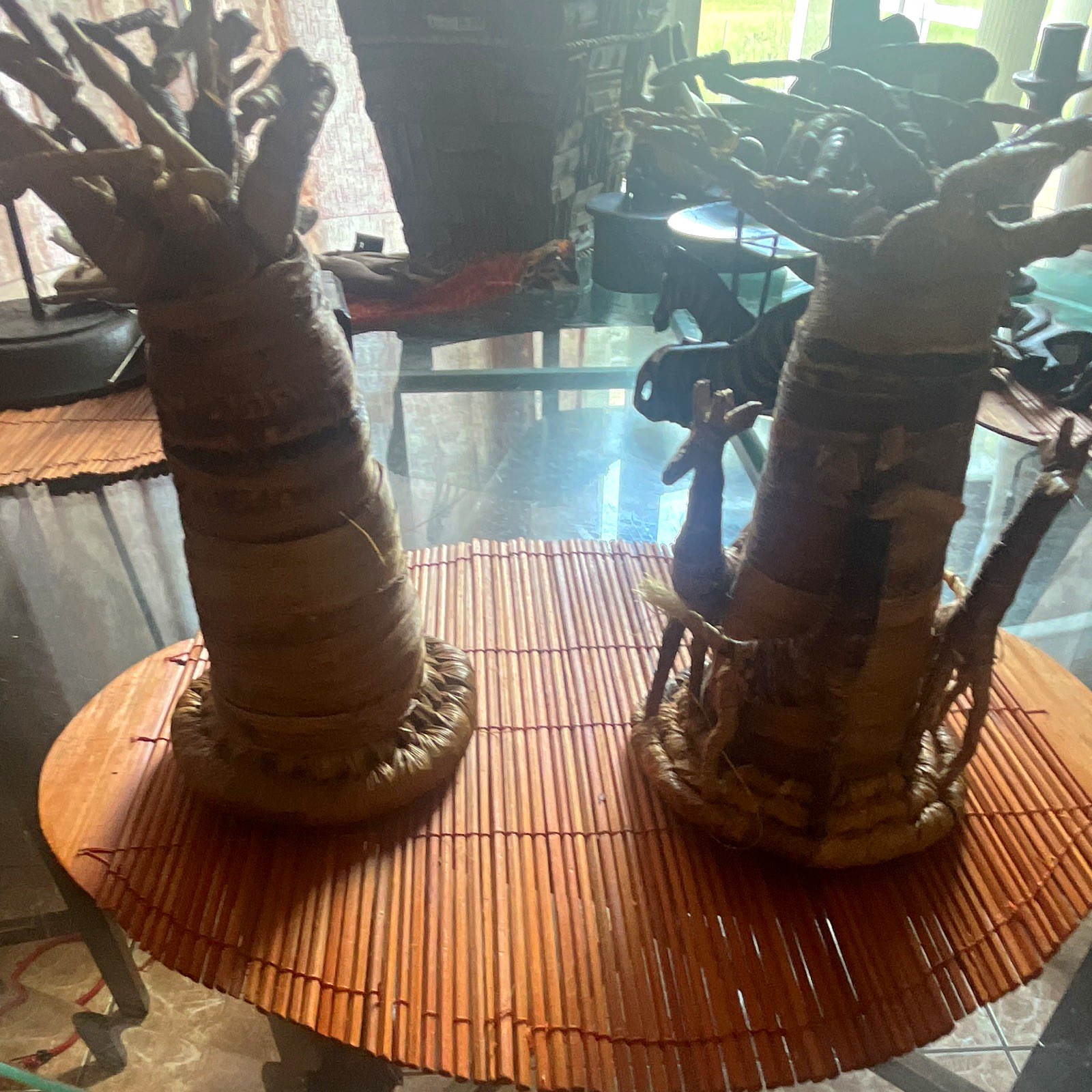 Pair of African Handmade Figurine Sculptures on Woven Bases - 2 Piece Pair of African Handmade Figurine Sculptures on Woven Bases - 2 Piece
