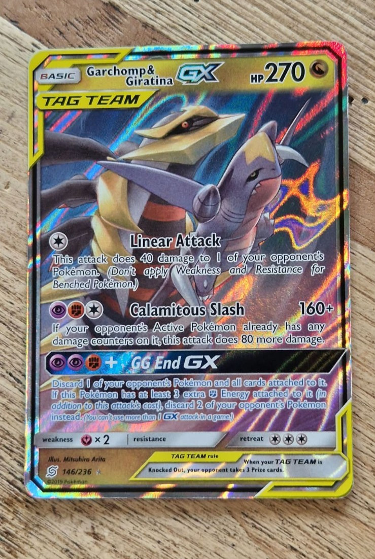Garchomp & Giratina GX 146/236 Tag Team Ultra Rare Unified Minds Holo - NM Garchomp & Giratina GX 146/236 Tag Team Ultra Rare Unified Minds Holo - NM