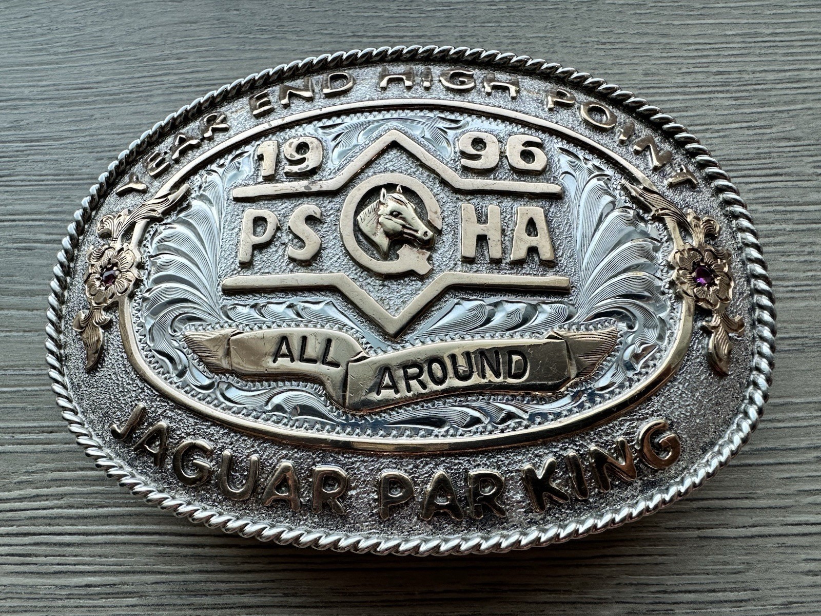 trophy belt buckle awarded for an equestrian competition achievement.