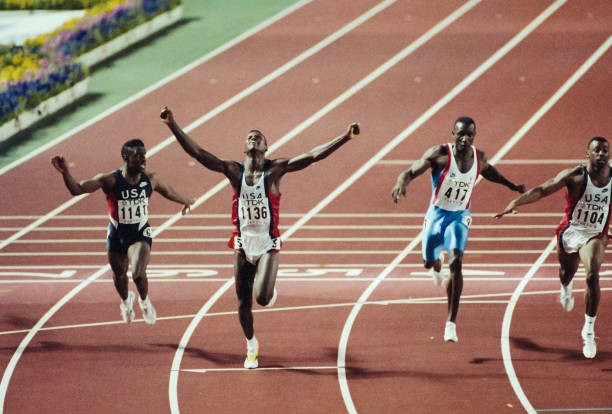 Carl Lewis USA runs a World Record time of 986 seconds to win the - Old Photo Carl Lewis USA runs a World Record time of 986 seconds to win the - Old Photo
