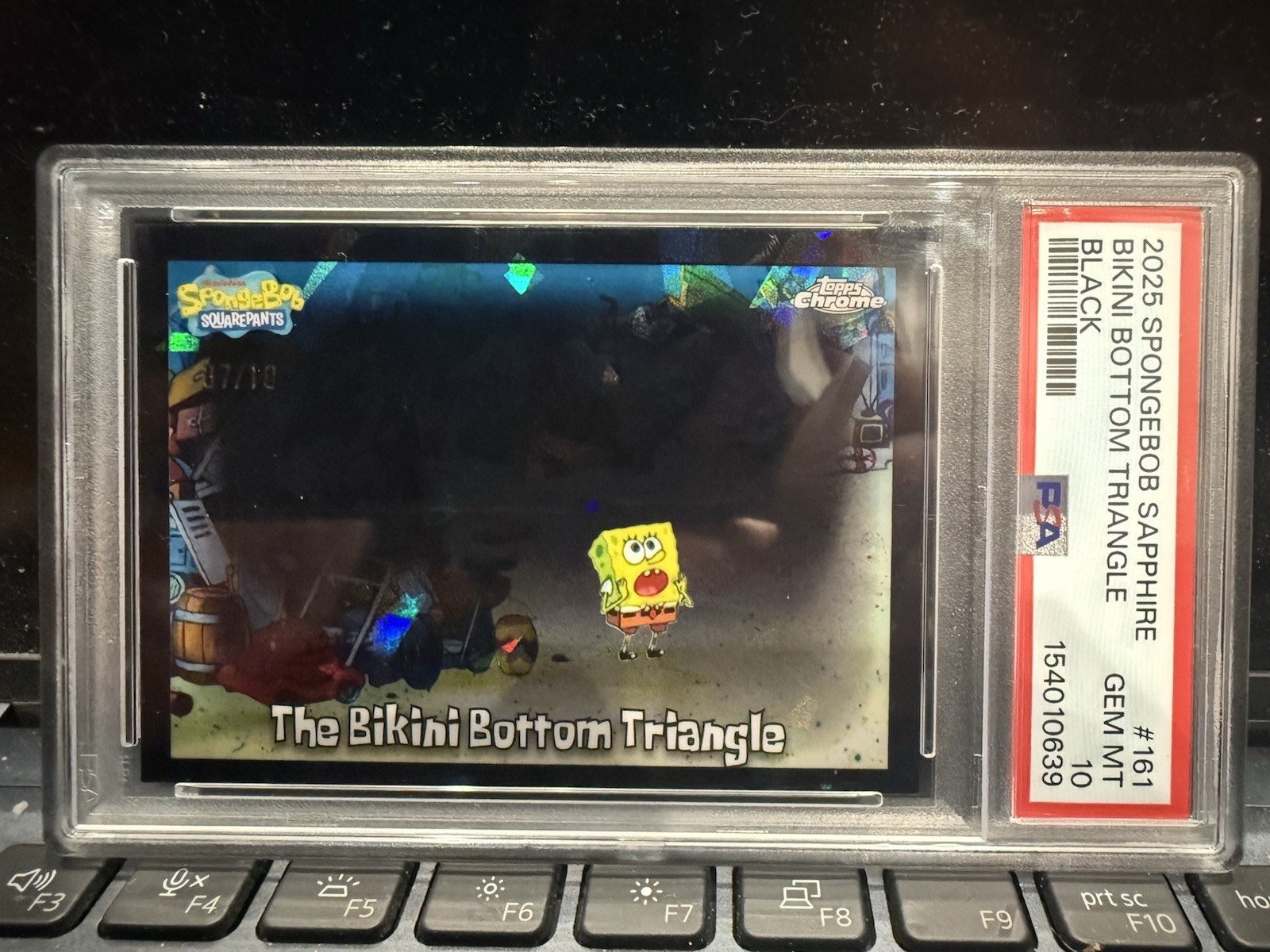 2025 Topps Chrome SpongeBob Sapphire The Bikini Bottom Triangle Black 7 /10 2025 Topps Chrome SpongeBob Sapphire The Bikini Bottom Triangle Black 7 /10