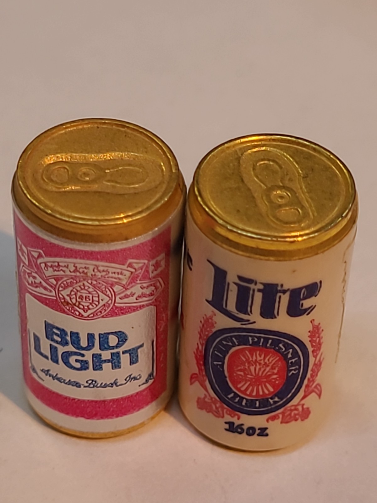 Vintage miniature brass novelty containers modeled after 1980s beer brands. 1\ Vintage miniature brass novelty containers modeled after 1980s beer brands. 1\