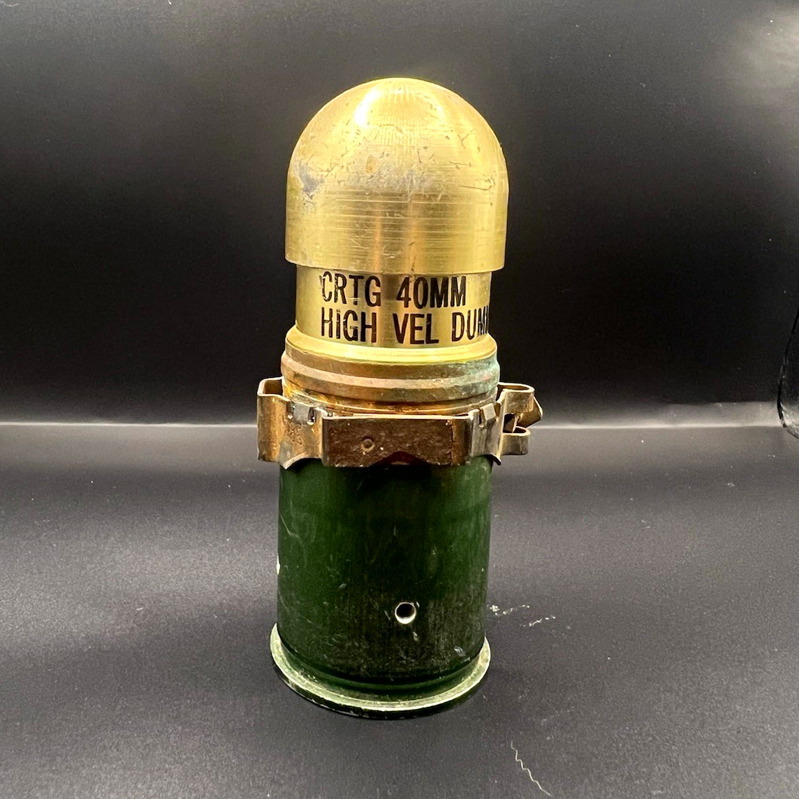 40mm High Velocity Dummy Cartridge Round, Green Brass Military Collectible 40mm High Velocity Dummy Cartridge Round, Green Brass Military Collectible