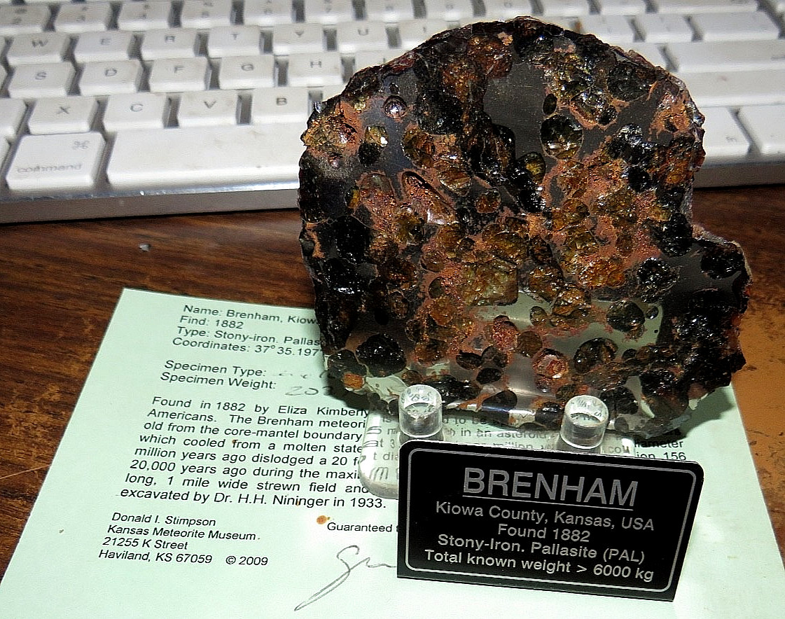Brenham pallasite meteorite  etched end  piece Weight 210 grams 3 inch