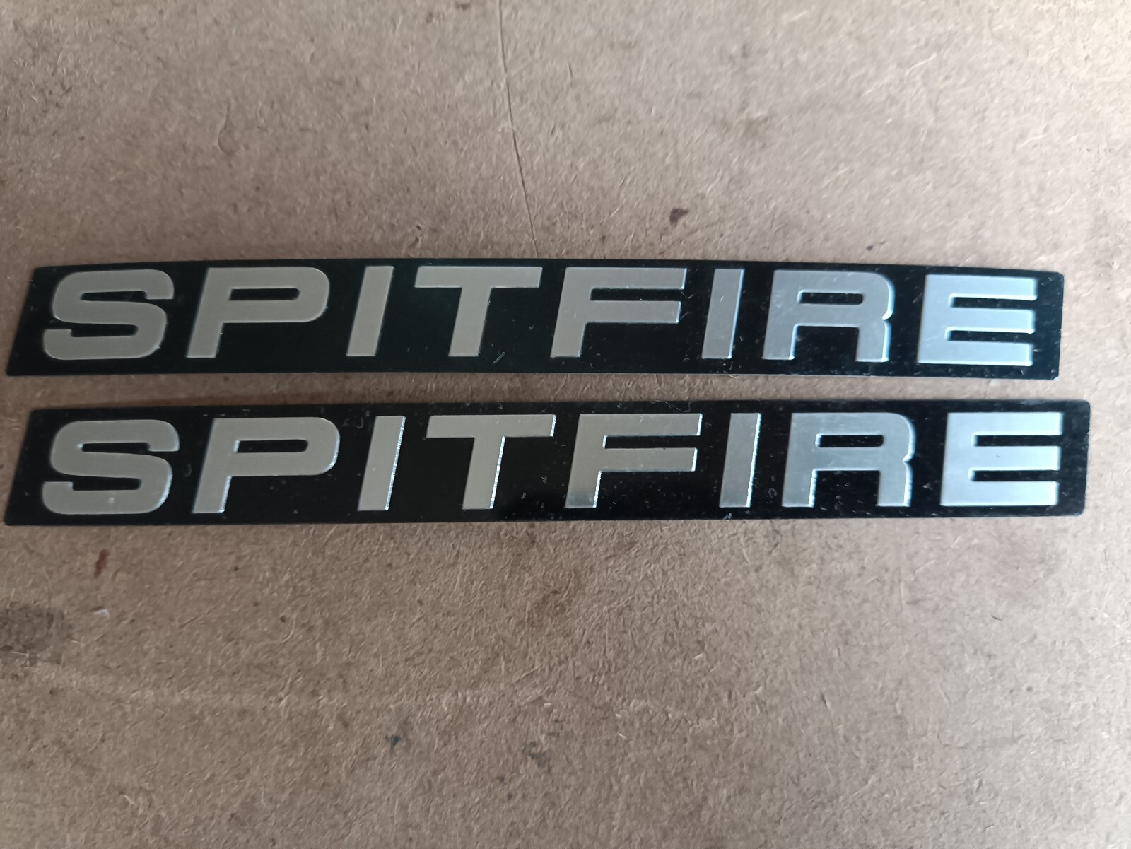 2 TRIUMPH SPITFIRE BADGE INSERTS EMBOSSED. NOS? Bargain price. 2 TRIUMPH SPITFIRE BADGE INSERTS EMBOSSED. NOS? Bargain price.