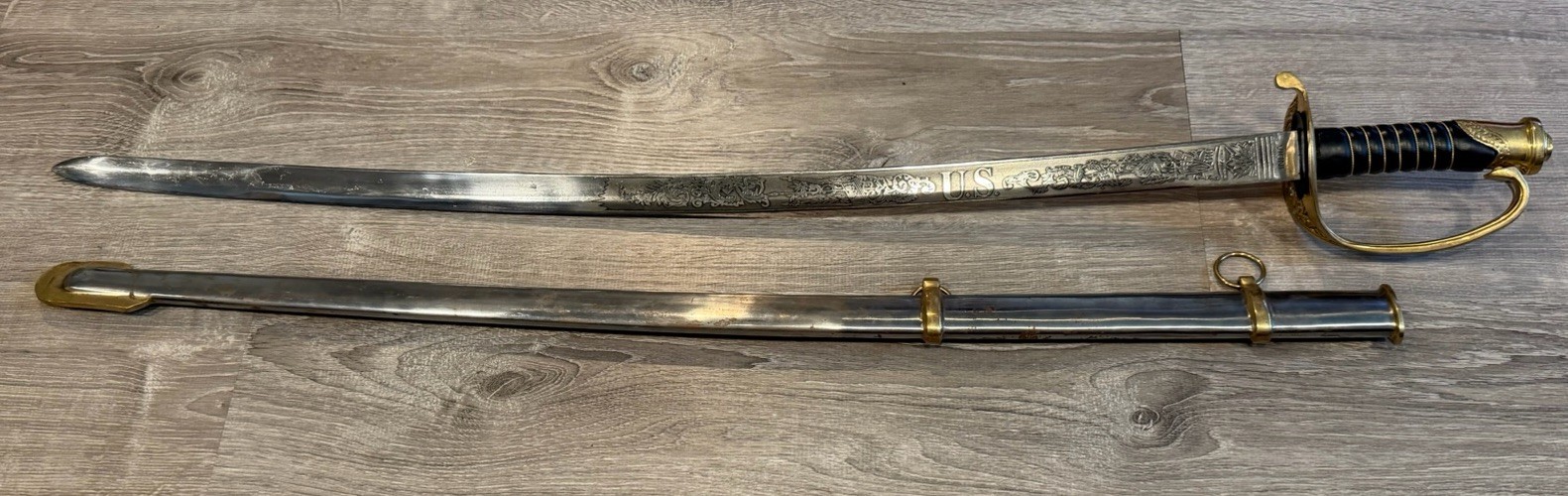 Reproduction Officer Civil War Sword with Scabbard Engraved U.S. Pluribus Reproduction Officer Civil War Sword with Scabbard Engraved U.S. Pluribus