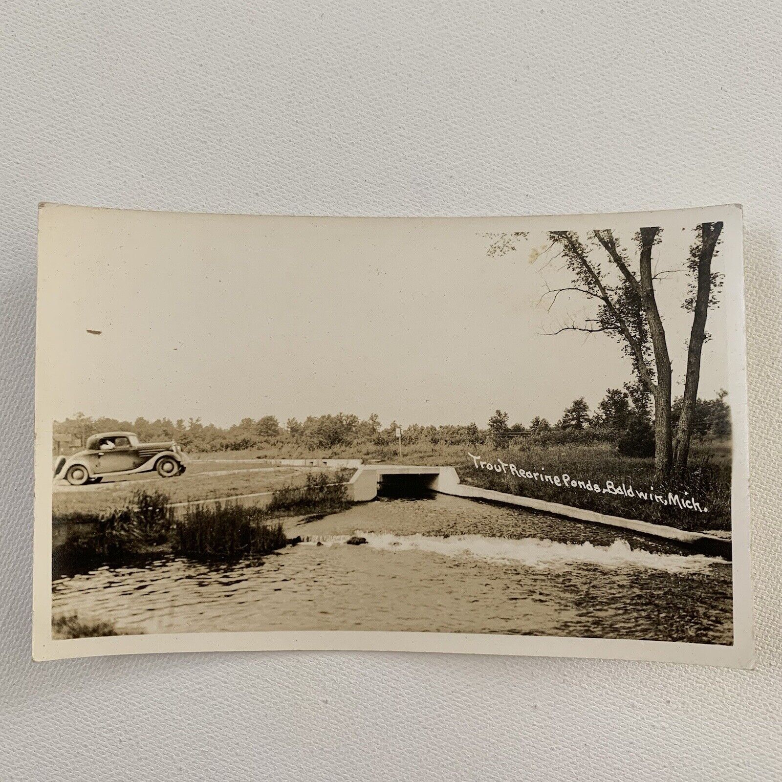 Antique/Vintage RPPC Real Postcard Car Driving Over Trout Pond Baldwin MI