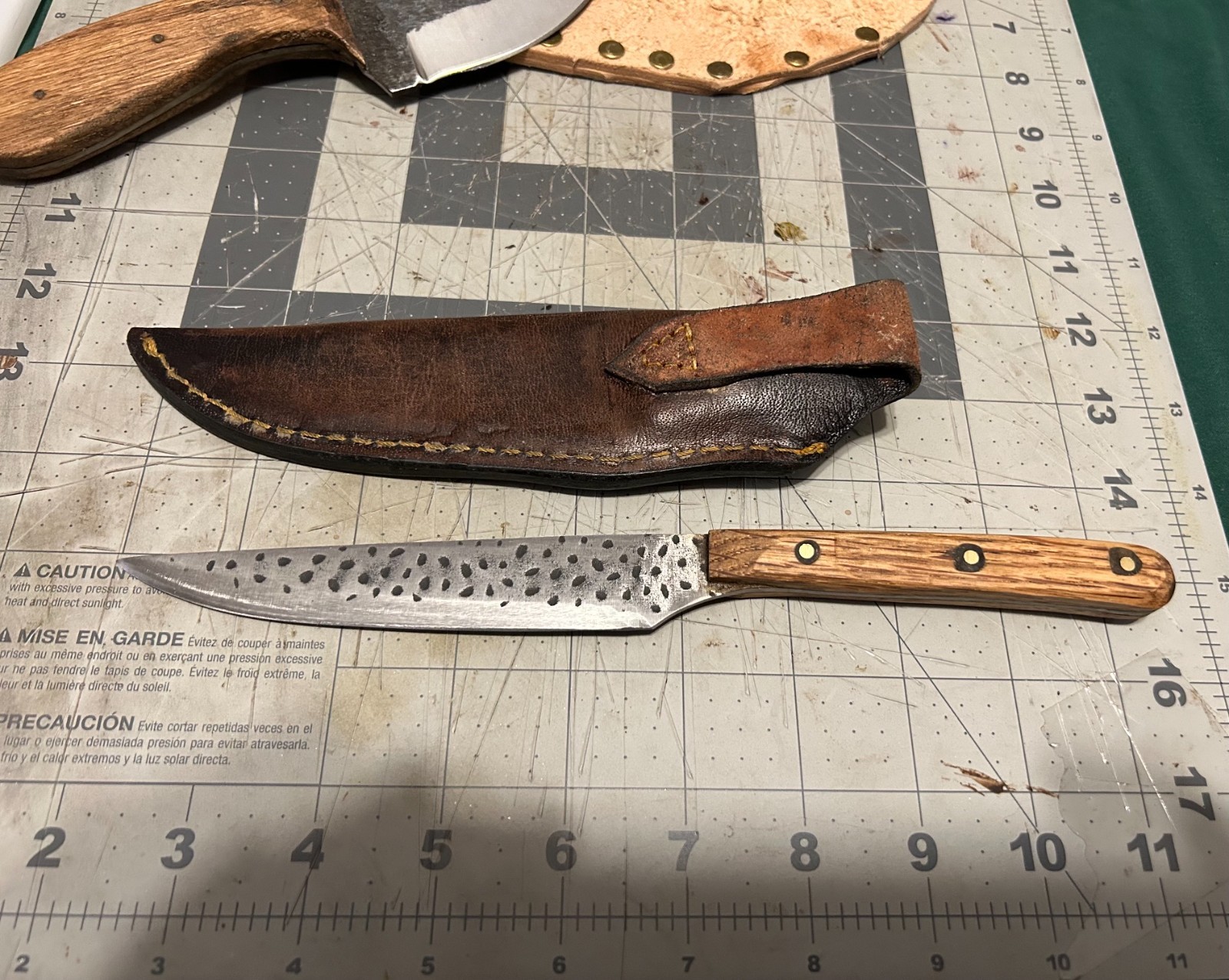 Two handmade fixed blade knives + leather sheaths. Two handmade fixed blade knives + leather sheaths.