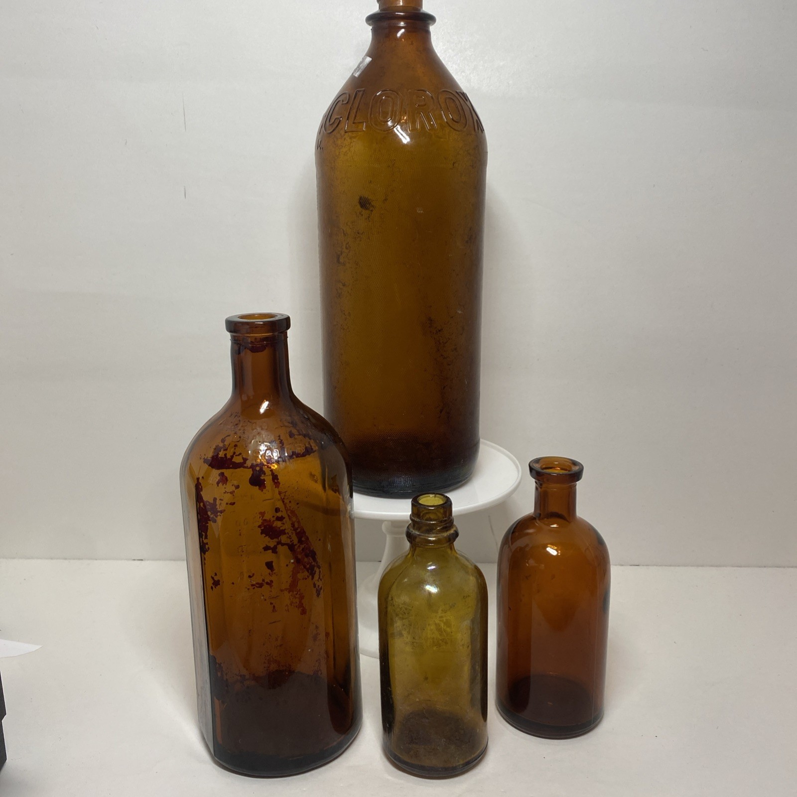 Lot Of 4 Antique VTG Mixed Use Amber Bottles Marked On Bottom 2 Large 2 Small Lot Of 4 Antique VTG Mixed Use Amber Bottles Marked On Bottom 2 Large 2 Small