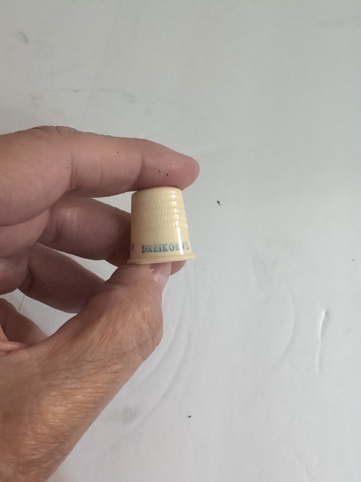 Dreikorns orange wrap bread plastic thimble - advertising thimble