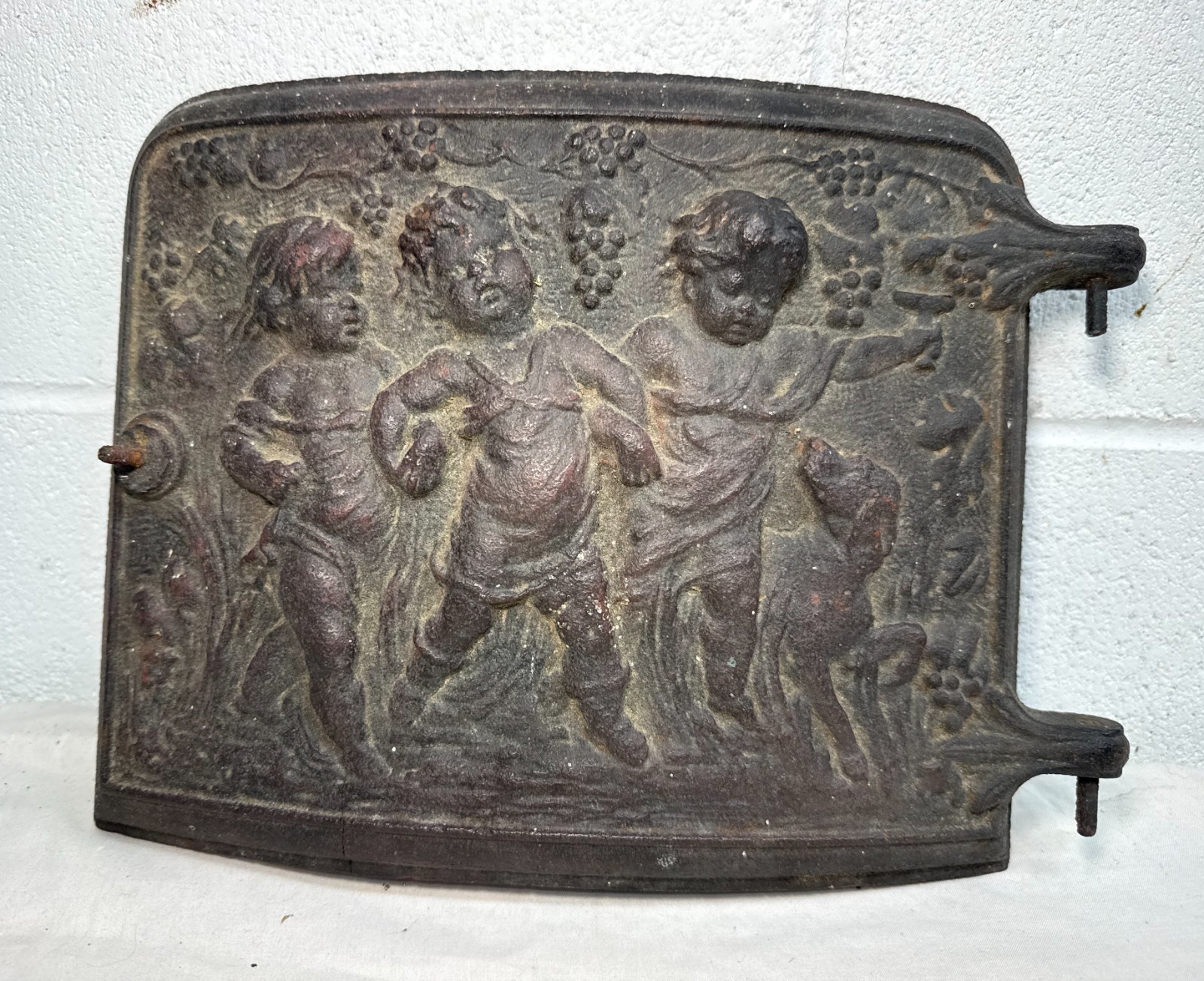 Antique 19th century thick cast iron stove door salvage cherub putti door panel