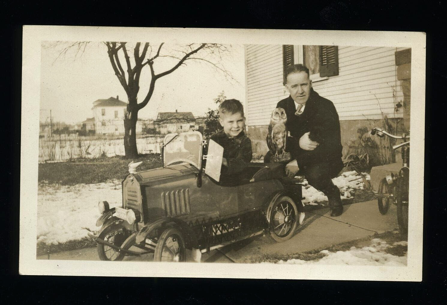 BOY DRIVING TOY PEDAL DERBY CAR WITH WEIRD OWL ON TRUNK 1920s VTG ANTIQUE PHOTO BOY DRIVING TOY PEDAL DERBY CAR WITH WEIRD OWL ON TRUNK 1920s VTG ANTIQUE PHOTO