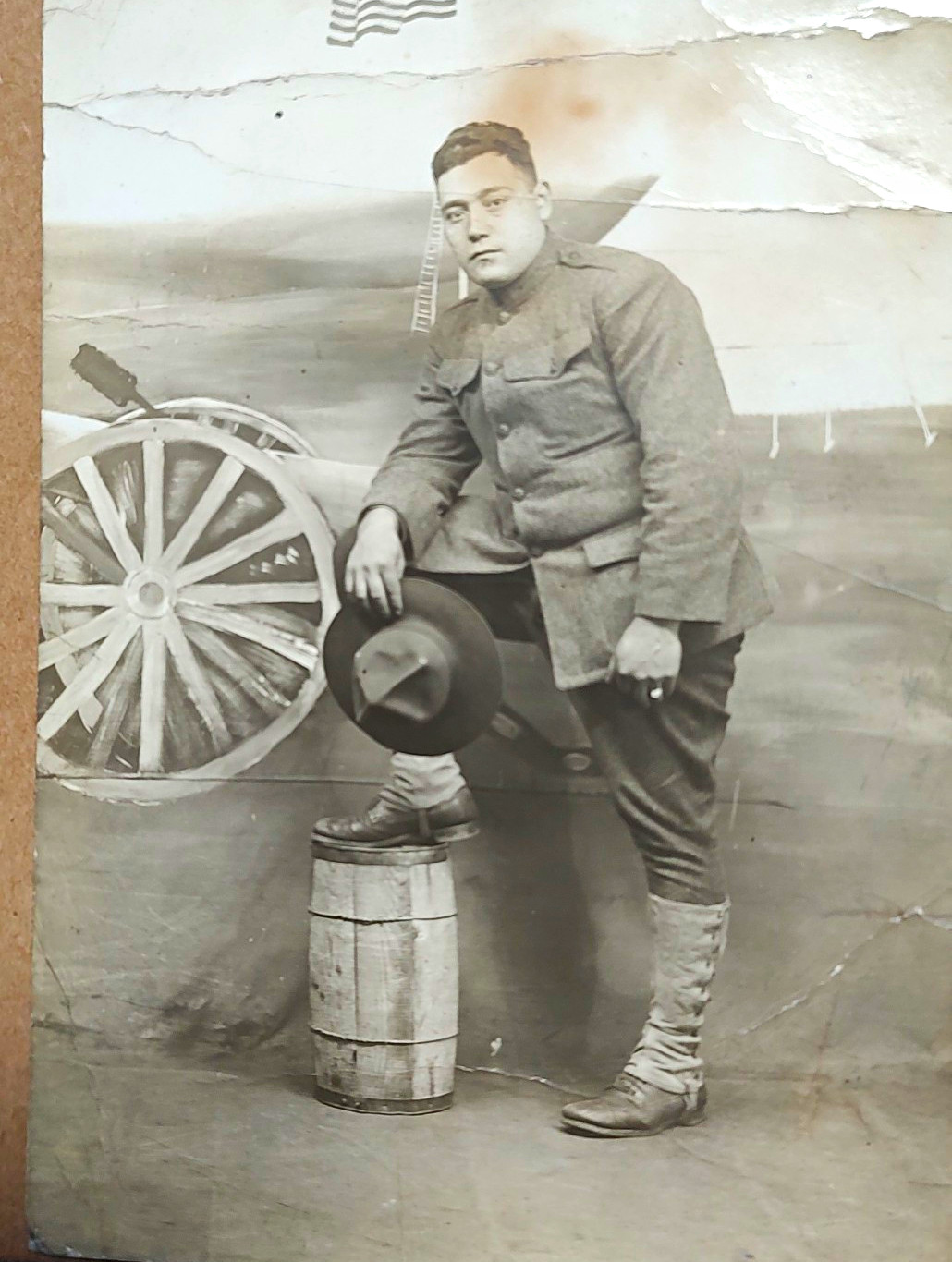 WWI Era RPPC Soldier in Uniform by Cannon,Flag  Has Creases  Divided Back.. P37
