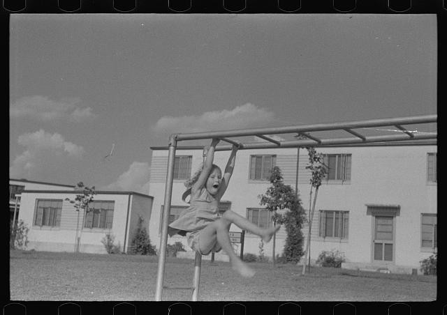 Photo:Greenbelt Maryland 1938 Child on Monkey Bars Residential Housing