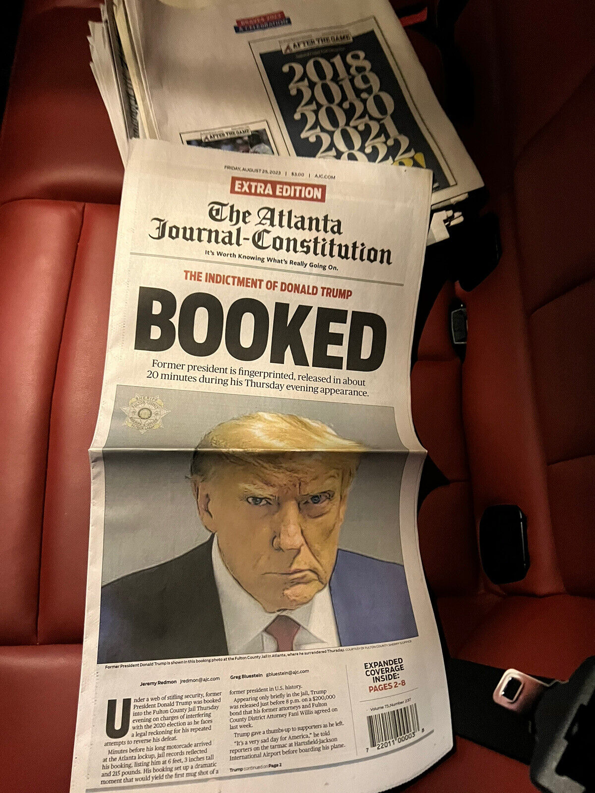 IN HAND Donald Trump Atlanta Journal Constitution Newspaper Mugshot Booked AJC