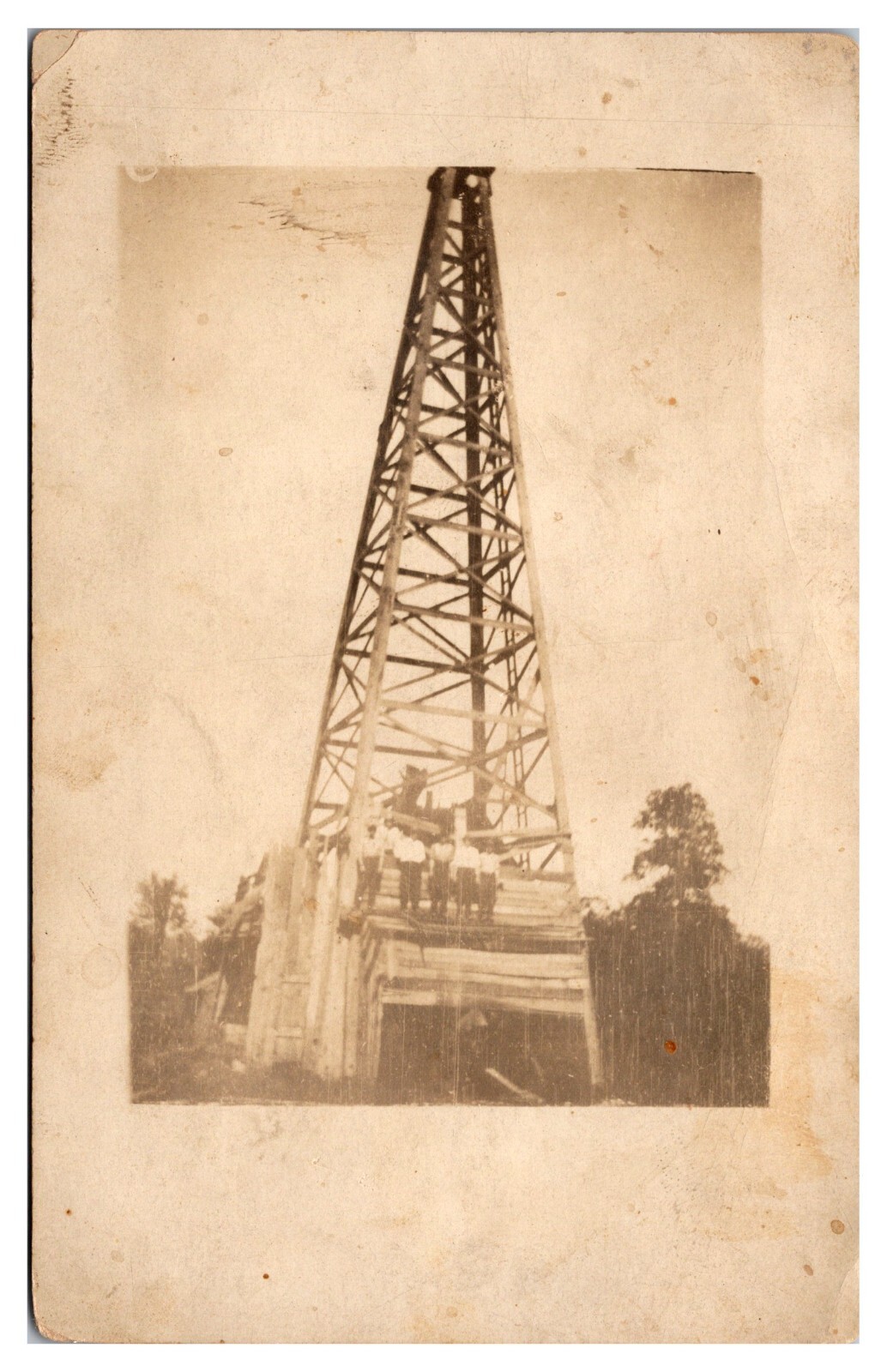 RPPC Early Oil Well, Men Posing on Top, CYKO Stamp Box, Ca. 1910, United States RPPC Early Oil Well, Men Posing on Top, CYKO Stamp Box, Ca. 1910, United States