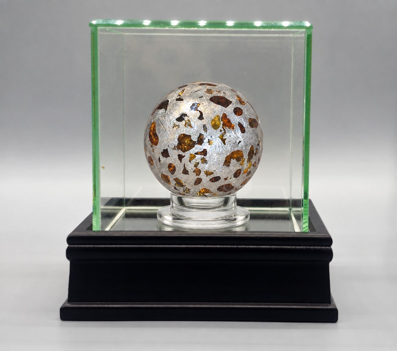 Pallasite Meteorite Sphere - 815 Grams - 64mm Pallasite Meteorite Sphere - 815 Grams - 64mm