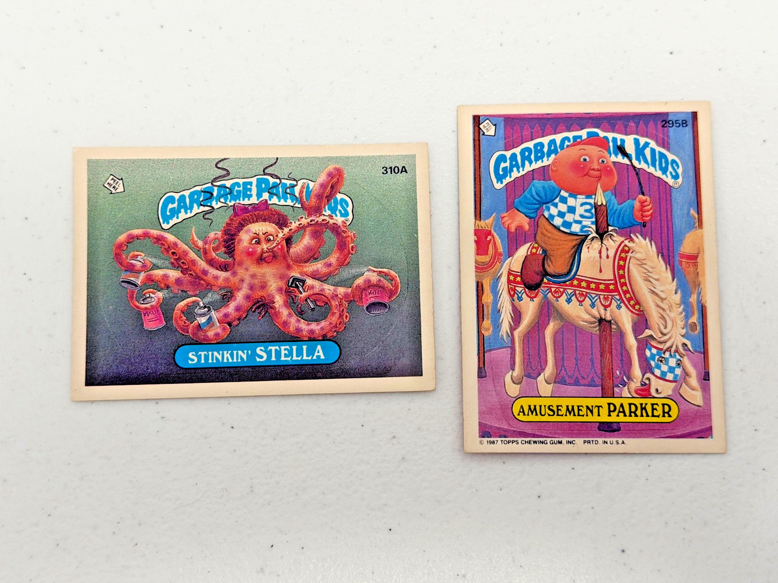 1987 TOPPS GARBAGE PAIL KIDS GPK 295B & 310A STINKIN STELLA AMUSEMENT PARKER