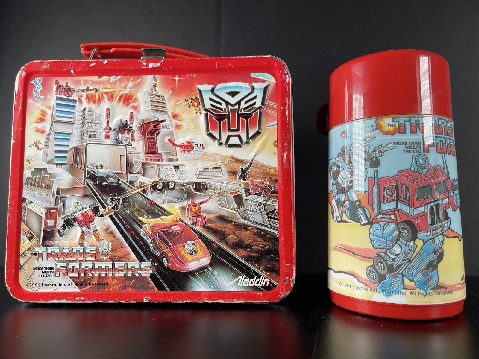 1986 Vintage Transformers Lunchbox Embossed Metal Aladdin USA Made Red Thermos 1986 Vintage Transformers Lunchbox Embossed Metal Aladdin USA Made Red Thermos